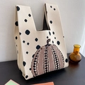 Knitted beige tote bag with black polka dots and large brown pumpkin graphic - Pumpkin Bag - Beige