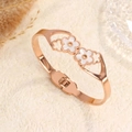 Rose gold flower bangle featuring white mother-of-pearl inlay and secure hinge closure - Rose Gold