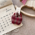 Detailed view of sweet red checkered cloth apple hair tie on a decorative paper card - Plaid Apple Hair Tie