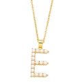 Macro shot of gold letter E pendant featuring inlaid white pearls and a fine chain - Letter E