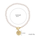Baroque pearl necklace with 2.5cm gold coin pendant and vintage relief on a 42cm chain - Gold Coin Relief Pearl Necklace