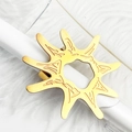 Golden sun-shaped stainless steel napkin ring with abstract embossed textures - Sunburst
