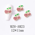 Detail view of 12x11mm golden cherry nail charms with pink crystals and green enamel leaf - Gold Base Large Pink Cherry (AM23)