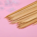 Natural bamboo skewers with sharp tips for bouquets and DIY crafts on pink background - 50 Bamboo Sticks