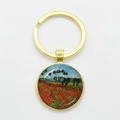 Artistic round keychain featuring Van Gogh poppy field painting with glass dome and gold ring - Gold-Poppies