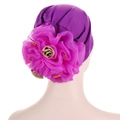 Detailed back view of a purple turban featuring a large rose with sparkling yellow rhinestones - Purple