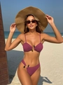 Detail of plum ribbed bikini set featuring decorative pebble beads on a beach background - S / Rouge Red