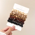 Detailed view of 6-piece brown satin scrunchies set on display card with soft lighting - 6 Colors Set Style 1