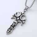 Macro shot of silver vintage skull cross sword pendant on a beaded chain necklace - Skull Cross Pendant