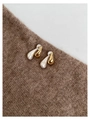 Macro detail of two-tone teardrop earrings showing gold polish and silver matte textures - Gold and Silver Two-tone Teardrop Studs