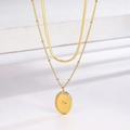 Collana a doppio strato dorata con catena a serpente, palline e ciondolo a stella - Collana Oro a Doppio Strato Stella Ovale