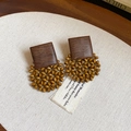 Detailed shot of retro tiger eye stone earrings with bohemian wooden beads on fabric - 10# Bohemian Woven Earrings (10#)