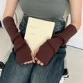 Detail of dark brown ribbed knit arm warmers styled with casual winter clothing - Coffee