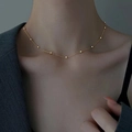 Close-up of a minimalist gold beaded snake chain choker worn on a model's neck - Single Layer Round Bead Chain Necklace / Gold
