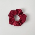 Close-up of a wine red satin scrunchie with silky luster and elastic pleated texture - Without Card / Burgundy