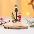 Close-up of lighted Christmas resin miniature with Santa and wood grain display base - Style A (Santa Claus)