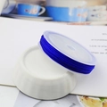 Detail view of dark blue 72 cord for bracelet weaving on a white ceramic bowl - 10m / Blue