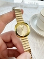 Detailed close-up of a square gold quartz watch featuring a metallic elastic expansion band - Gold Steel Strap Gold Dial