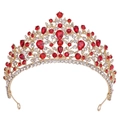 Close-up of golden bridal tiara featuring red teardrop gemstones and white crystals - Gold with Red Rhinestones