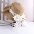 Light khaki wide brim straw sun hat featuring a white lace bow tie and woven texture - Lace Bow Straw Hat Khaki