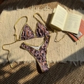 Flat lay of leopard print bikini with gold metallic straps on rustic woven fabric background - S / Gold