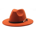 Detail of caramel wool fedora hat featuring a black leather band and gold buckle accent - Caramel color