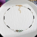 Handmade necklace with white beads, black accents and three natural stone pendants - Style 8