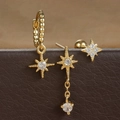 Macro shot of gold star tassel earrings set with cubic zirconia on brown leather - Style 2 (E1603-2) / Gold