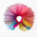 Close-up of rainbow tulle pet tutu with a magenta satin ribbon bow for dog costumes - Colorful