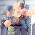 Pastel LED cotton ball string lights in macabre tones for warm bedroom decor - Macarons