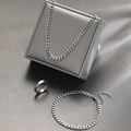 Detailed view of silver stainless steel jewelry set with Cuban chain necklace and ring - Stainless Steel 3-piece Set / Silver