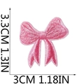 Pink embroidered bow patch measuring 3.3x3.0 cm with precise size marking on white background - Style A