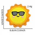 Detail of embroidered sun patch showing 6.6x6.6cm size and vibrant yellow stitching - Sun