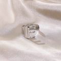 Minimalist silver stainless steel open ring with bold capital letter E on silk background - Letter E / Silver