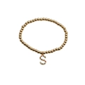 Gold beaded stretch bracelet featuring a colorful cubic zirconia letter S charm pendant - S