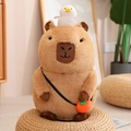 Brown capybara plush toy with small white bird on head and orange crossbody bag - Sitting Squeaking / 20cm