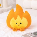 Cute orange plush flame pillow with a smiling face on a cozy white checkered bed - Flame Pillow / 46cm