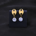 Gold coffee bean earrings with round zircon stones on black textured background - Gold Stud Earrings