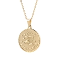 Macro shot of gold stainless steel Sagittarius pendant with detailed embossed patterns - Sagittarius