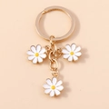 Daisy floral keychain with gold ring and three white enamel flower charms for bags - White