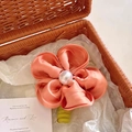 Elegant coral orange fabric flower brooch with a large pearl center in a woven basket - Orange [Midsummer Flower]