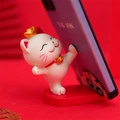 Lucky cat phone stand in white resin with red and gold accents for desk decor - Rising Phone Holder