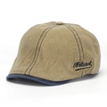 Side view detail of a vintage washed denim flat cap featuring 'Natural' embroidered patch. - One Size / Light Coffee With Blue Brim (F)