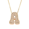 Detailed view of golden cursive letter A pendant necklace with micro zircon stones - Letter A / Gold