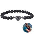 Macro detail of natural black lava stone beads and custom heart photo projection pendant - Lava Rock Bracelet