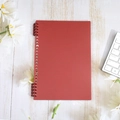Matte dark red B5 binder with matching rings on a white wood desk with daisies - B5-26 Holes / Retro Red (2 Pieces Including Clip)