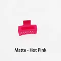 Detail view of mini matte magenta claw clip with hollow square design and smooth teeth - Matte Rose Red