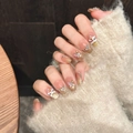 Close-up of handmade press-on nails with 3D lion head, butterfly, and golden glitter charms - Extra Small (XS) / Short Coffin