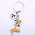 Enamel Corgi keychain with paw print charm and colorful bells on silver-tone ring - Corgi (Corgi Paw)