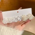 White 3D floral hair clip with five pearlescent flowers on white display card - White/Beige Flower Hair Clip (6# Silver Earring Post)